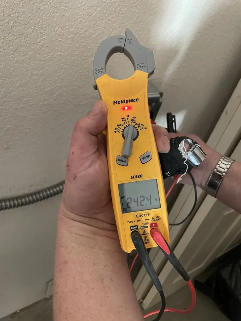 Voltage testing with clamp meter during Ceiling Fan Installation in Suamico